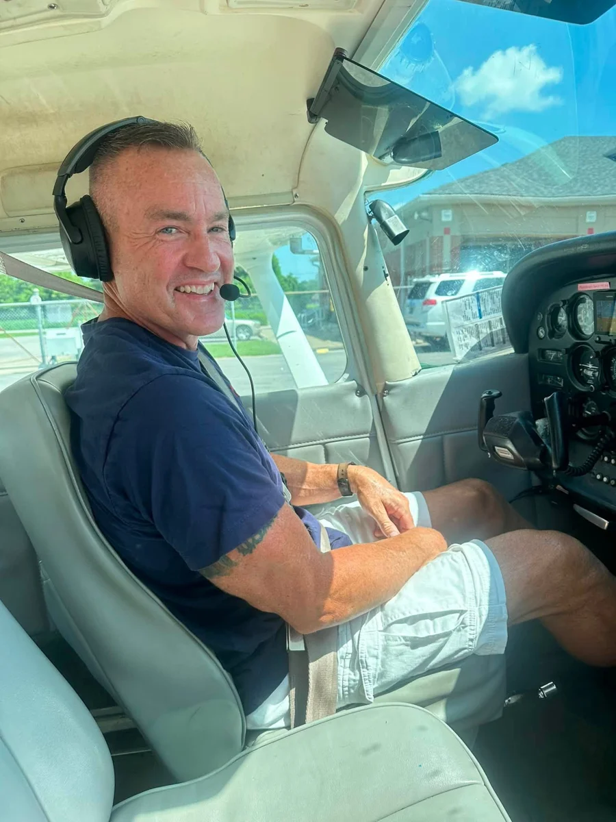 Jason Newby in the pilot seat, from his first solo celebration